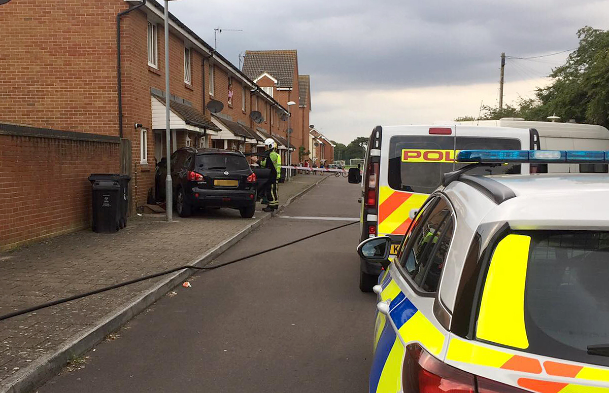 Emergency Services Close Road As Car Crashes Into House In Swindon
