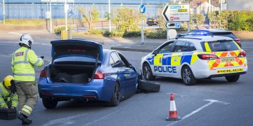 Driver tries to flee crash in damaged BMW but ditched it when wheel fell off