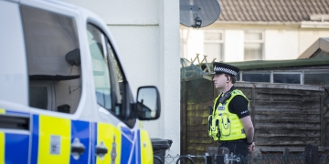 Police guard house after blaze ripped through Swindon property in early hours