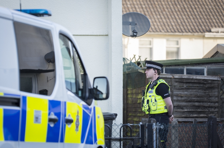 Police guard house after blaze ripped through Swindon property in early hours