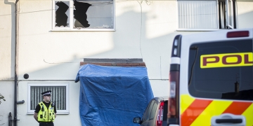 Police guard house after blaze ripped through Swindon property in early hours