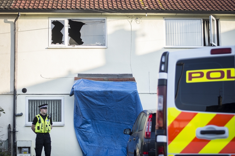 Police guard house after blaze ripped through Swindon property in early hours