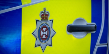 Woman charged with damaging police van and assaulting police officer