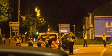 Man arrested for assault after spending three hours on roof of house