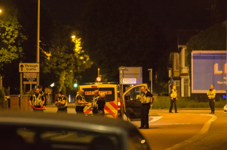 Man arrested for assault after spending three hours on roof of house