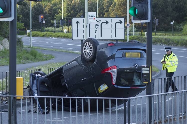 Woman driver injured after hitting traffic light and flipping car in Swindon