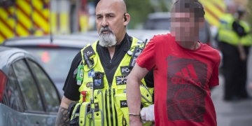Three men arrested after woman rescued from house fire in Swindon