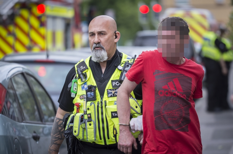 Three men arrested after woman rescued from house fire in Swindon