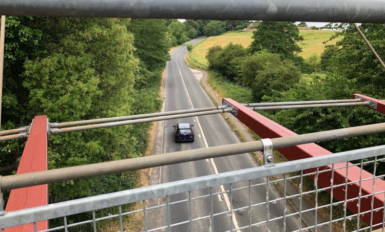Vehicle struck by stone as youths launch missiles from bridge over A4