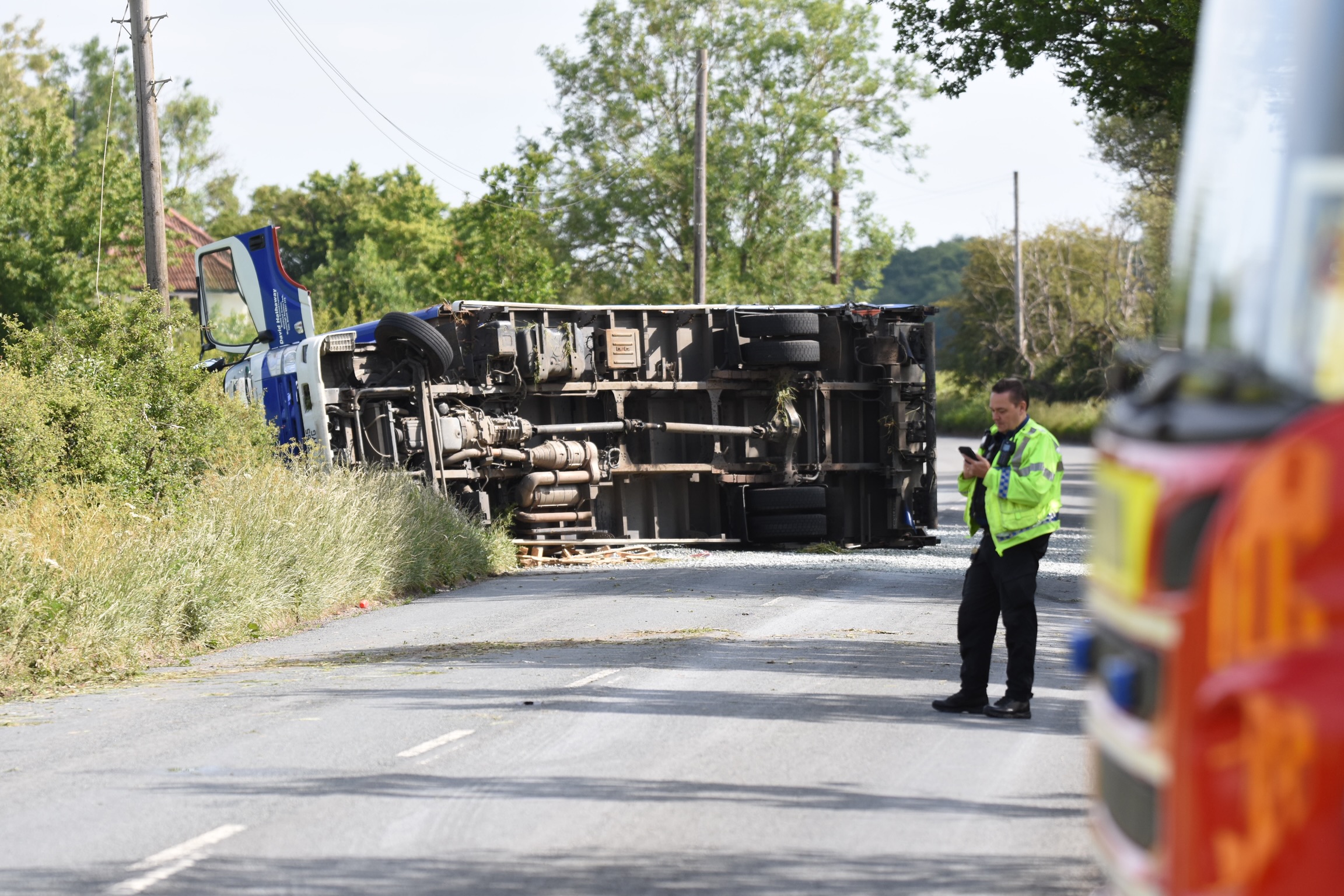 Country lane near Royal Wootton Bassett closed as lorry overturns in crash