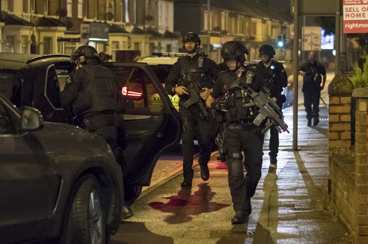 Man climbs onto rooftop in bid to escape armed police in central Swindon