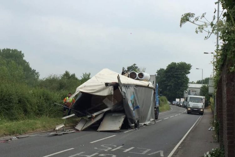 A36 blocked as lorry strikes low bridge in Wilton shedding its load
