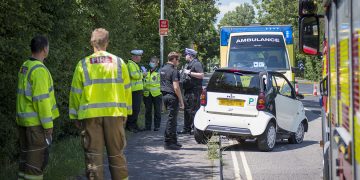 Road closed as woman trapped inside overturned car in Swindon