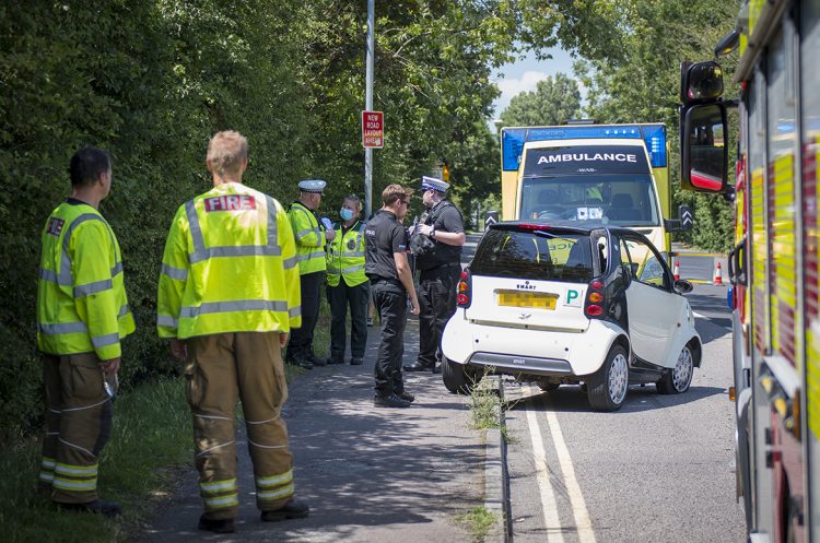 Road closed as woman trapped inside overturned car in Swindon