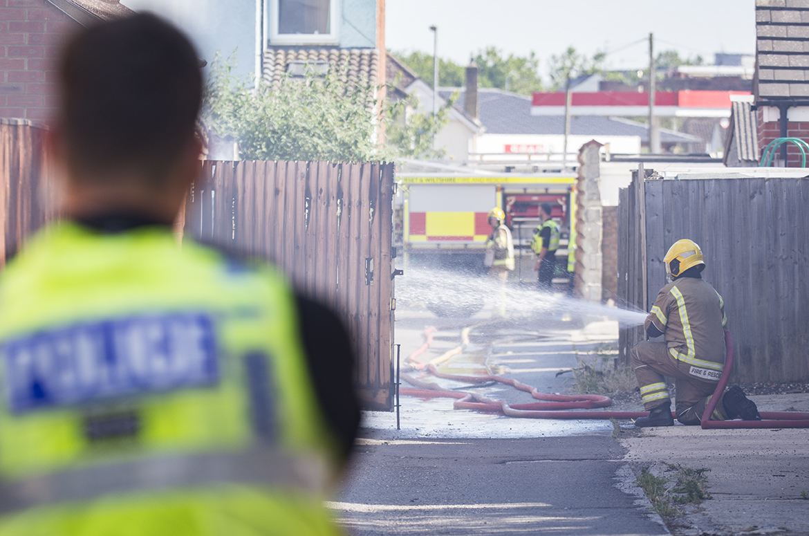 Explosions heard as firefighters battle blaze at back of house in Swindon