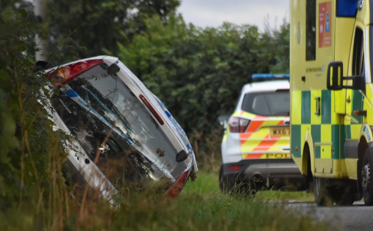 Emergency services called to free man from car after crashing into ditch