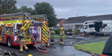 Firefighters from two stations extinguish a camper van ablaze in Swindon
