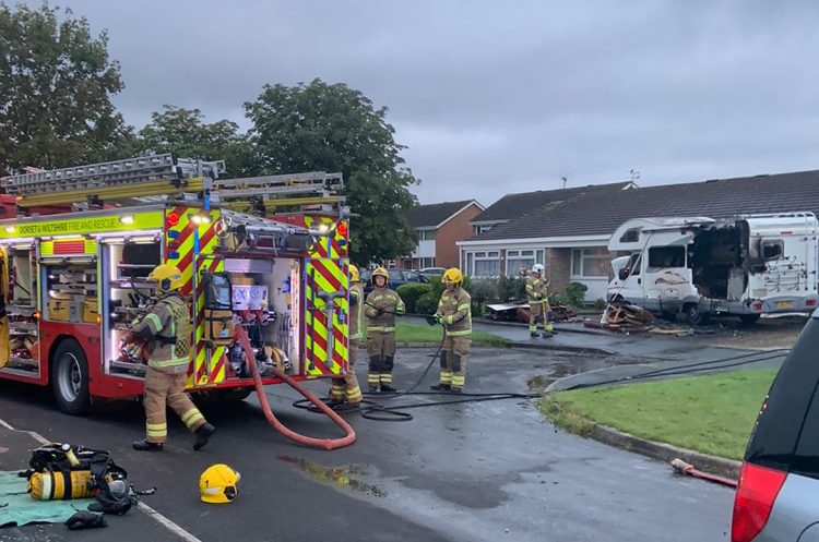 Firefighters from two stations extinguish a camper van ablaze in Swindon