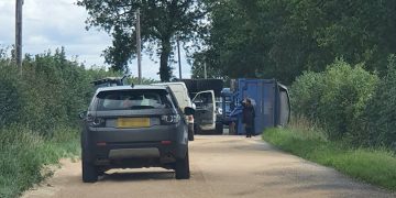 Crash involving tractor and overturned trailer blocks B4040 in both directions