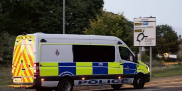 Riot vans patrol Swindon as businesses take security measures ahead of rave