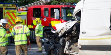 Passenger of van trapped in cab after colliding with lorry near Swindon