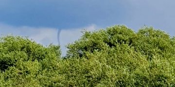 Early-stage tornado known as a funnel cloud spotted in sky near Swindon