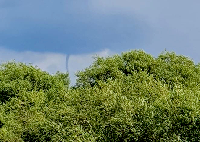 Early-stage tornado known as a funnel cloud spotted in sky near Swindon