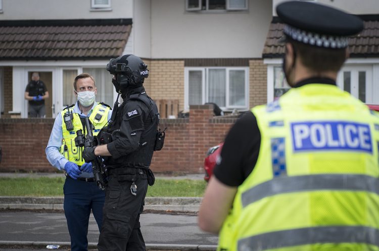 Road closed as armed police raid house in search of suspect in Swindon
