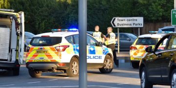 Police and ambulance at scene of motorcycle crash on roundabout in Melksham