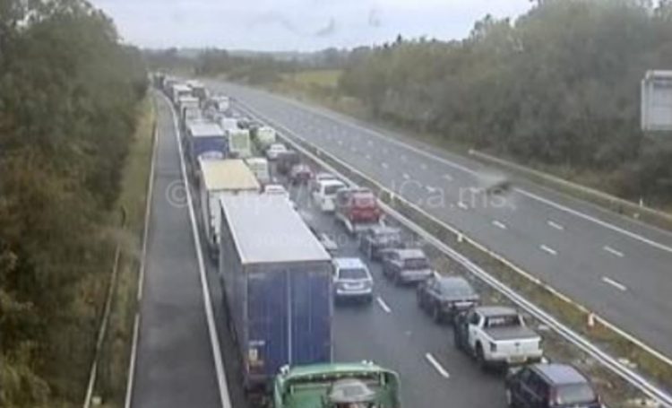 M4 blocked in both directions as emergency services attend overturned car