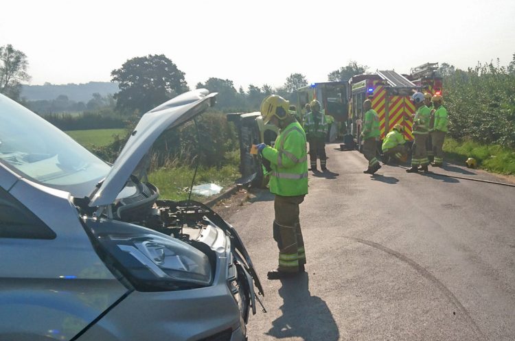 Fire crews rescue injured woman from overturned car on country road near Calne