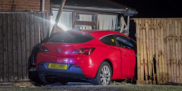 Man charged with drink driving after car crashes through garden in Swindon