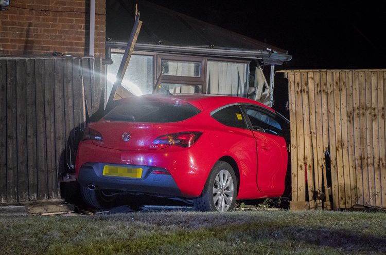 Man charged with drink driving after car crashes through garden in Swindon