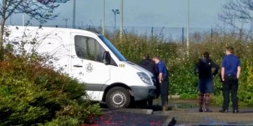 Detectives and three forensic investigators at house after two people found dead