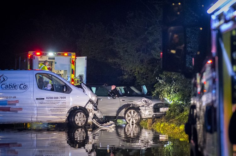 Police dog searches fields as driver flees scene of crash in flood near Swindon