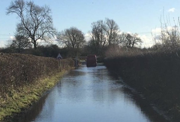 Driver ‘added to naughty list’ after ignoring road closed sign and getting stuck in flood