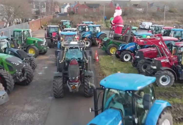 Eagle-eyed police spot woman filming charity tractor procession whilst driving