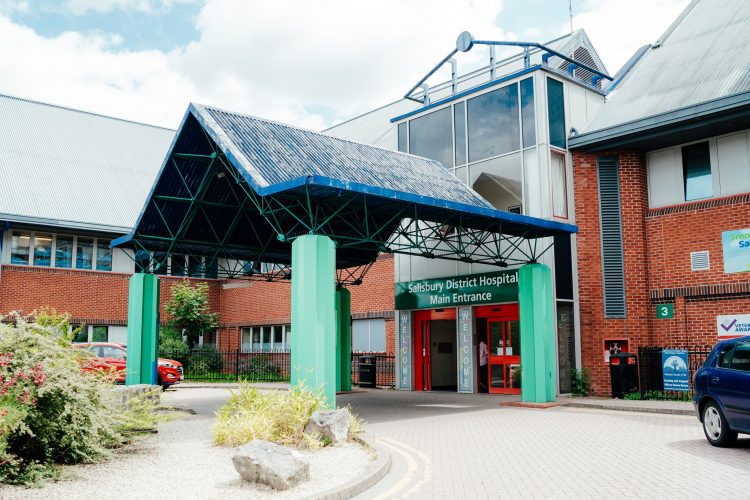 Hospital suspends visiting as it struggles to cope with influx of COVID-19 patients