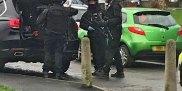 Armed police swarm street after receiving 999 call reporting shooting in Swindon