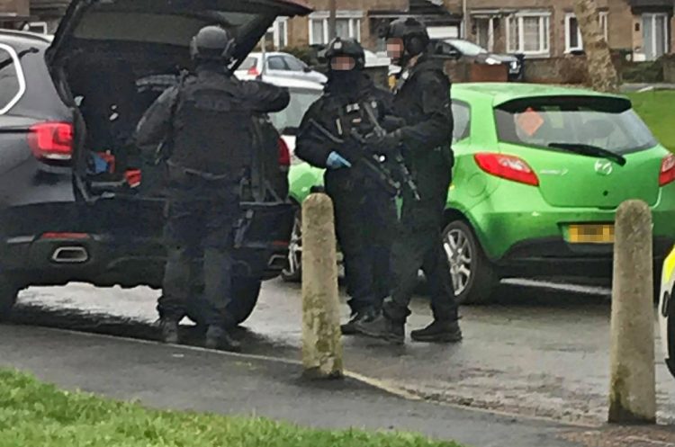 Armed police swarm street after receiving 999 call reporting shooting in Swindon
