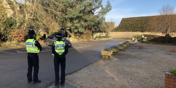 Police establish checkpoint at popular National Trust site as tourists continue to visit