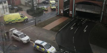 Man sat on edge of multi-storey car park sparks large emergency response