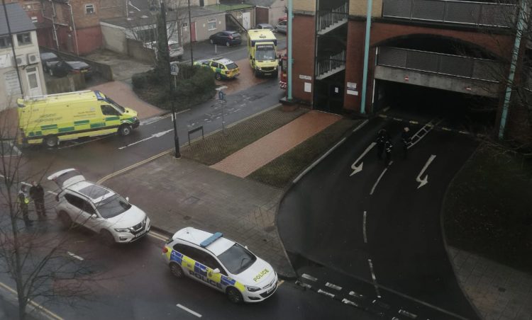 Man sat on edge of multi-storey car park sparks large emergency response