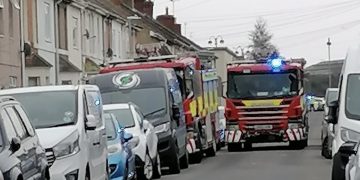 Swindon road closed by police as firefighters tackle back-garden shed blaze