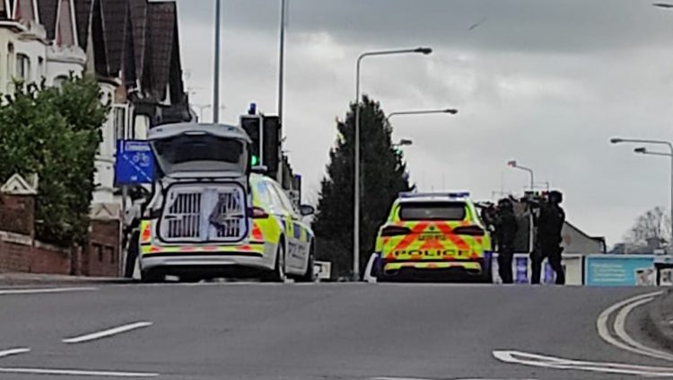Police close central Swindon road as armed officers descend on house