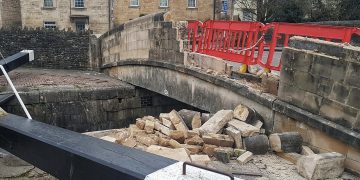 Vehicle partially demolishes Bradford on Avon canal bridge in evening crash