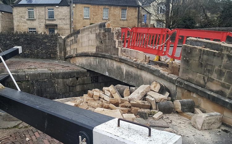 Vehicle partially demolishes Bradford on Avon canal bridge in evening crash