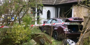 Driver arrested for drugs and weapons offences after ploughing car into house