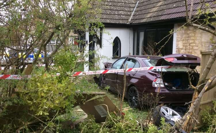 Driver arrested for drugs and weapons offences after ploughing car into house