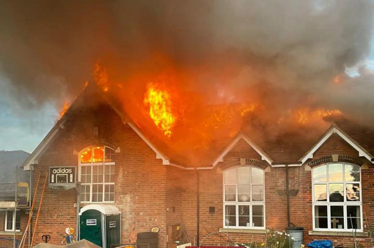 Smoke fills street as firefighters battle primary school blaze in Wiltshire village